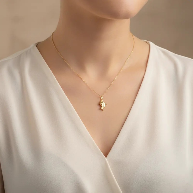 Colgante doble delfín en oro amarillo de 18 kt | 2 cm