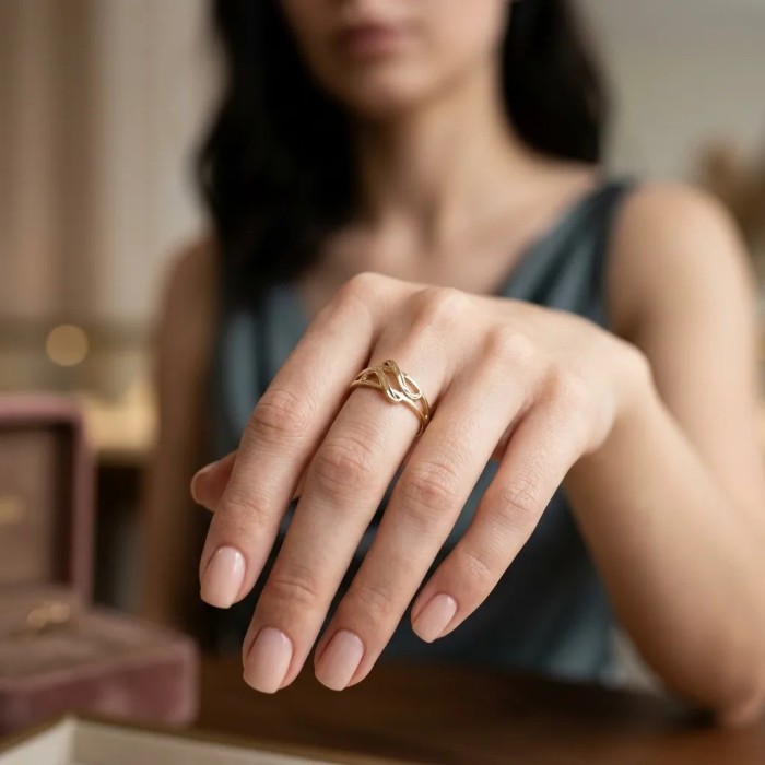 Anello "Intreccio Sinuoso" in Oro Giallo 18kt 2